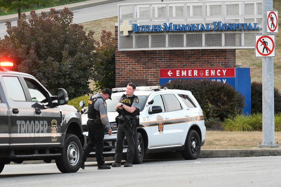 Pennsylvania State Troopers guard the entrance to Butler Memorial Hospital, Saturday, July 13, 2024, where Republican presidential candidate former President Donald Trump was said to be taken after shots were fired at a campaign rally in Butler, Pa. (AP Photo/Don Wright)