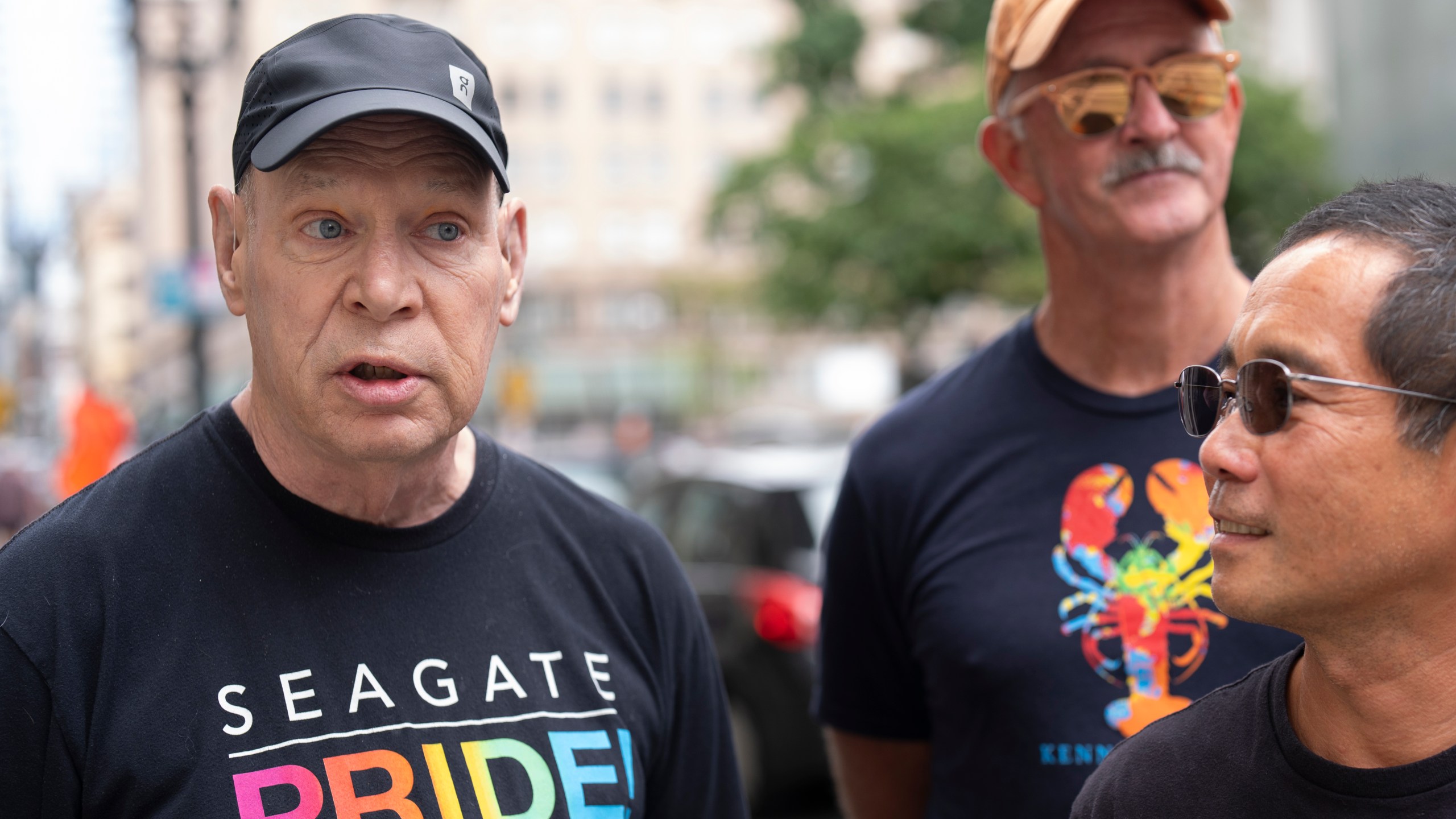 Arthur Downard Jr., left, a 72-year-old resident of Portland, Ore., speaks to the Associated Press after President Joe Biden dropped out of the 2024 race for the White House on Sunday, July 21, 2024, in Portland, Ore. The Democratic voter, who cast his ballot for Biden in 2020, said his opinion of him changed after what he called a "disastrous" debate. "He's been a great president and he's gotten a lot done for our country. But he's too old, he's not articulate," he said. "He's not a good messenger for the Democratic Party." (AP Photo/Jenny Kane)