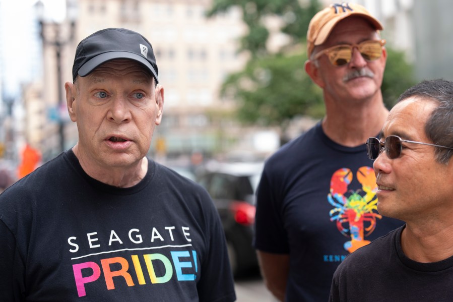 Arthur Downard Jr., left, a 72-year-old resident of Portland, Ore., speaks to the Associated Press after President Joe Biden dropped out of the 2024 race for the White House on Sunday, July 21, 2024, in Portland, Ore. The Democratic voter, who cast his ballot for Biden in 2020, said his opinion of him changed after what he called a "disastrous" debate. "He's been a great president and he's gotten a lot done for our country. But he's too old, he's not articulate," he said. "He's not a good messenger for the Democratic Party." (AP Photo/Jenny Kane)