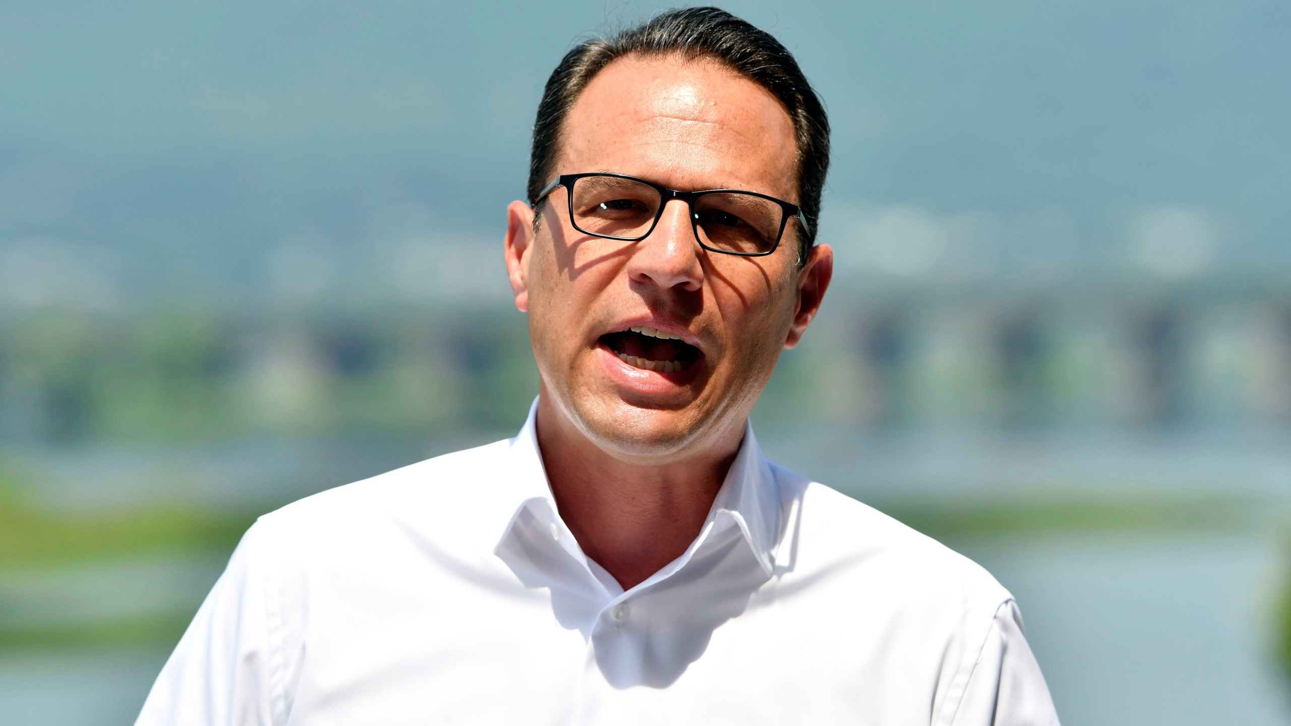 Pennsylvania Gov. Josh Shapiro speaks during a news conference overlooking the Susquehanna River from a balcony at the offices of the Susquehanna River Basin Commission, Tuesday, July 9, 2024, in Harrisburg, Pa. (AP Photo/Marc Levy)