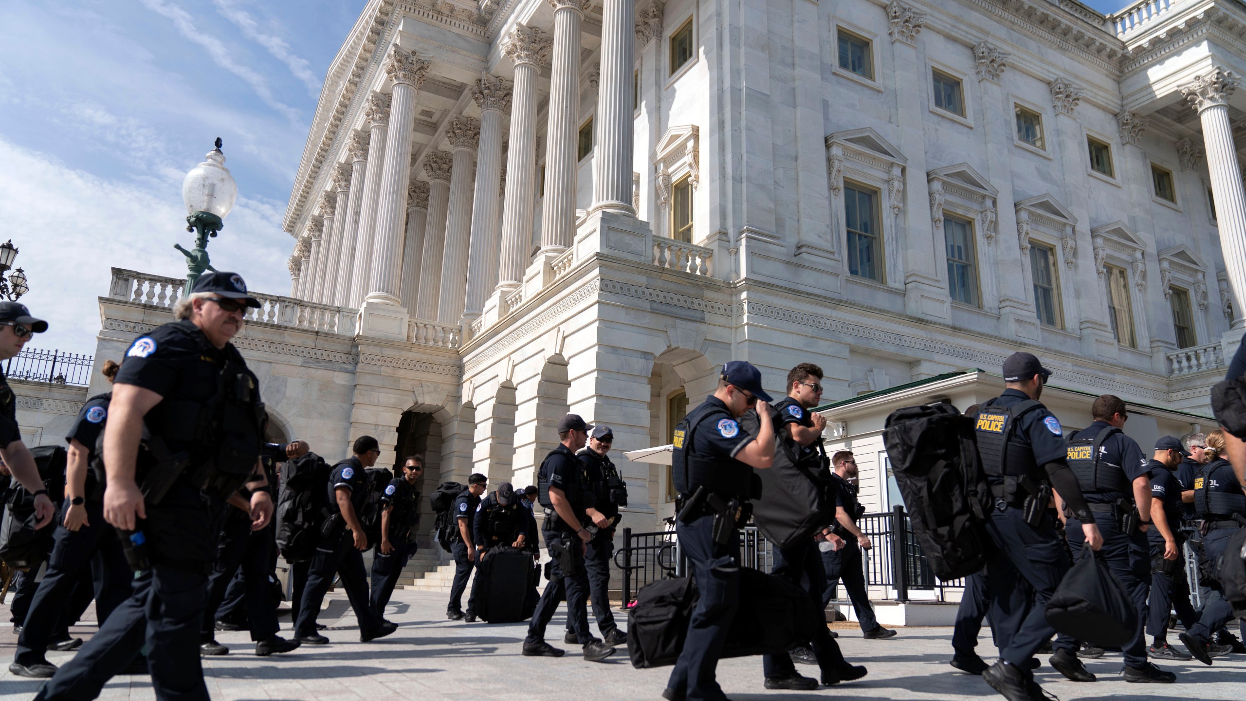 U.S Capitol police officers walk into the Capitol building a day before of Israel's Prime Minister Benjamin Netanyahu visit to Capitol Hill, Tuesday, July 23, 2024, in Washington. ( AP Photo/Jose Luis Magana)