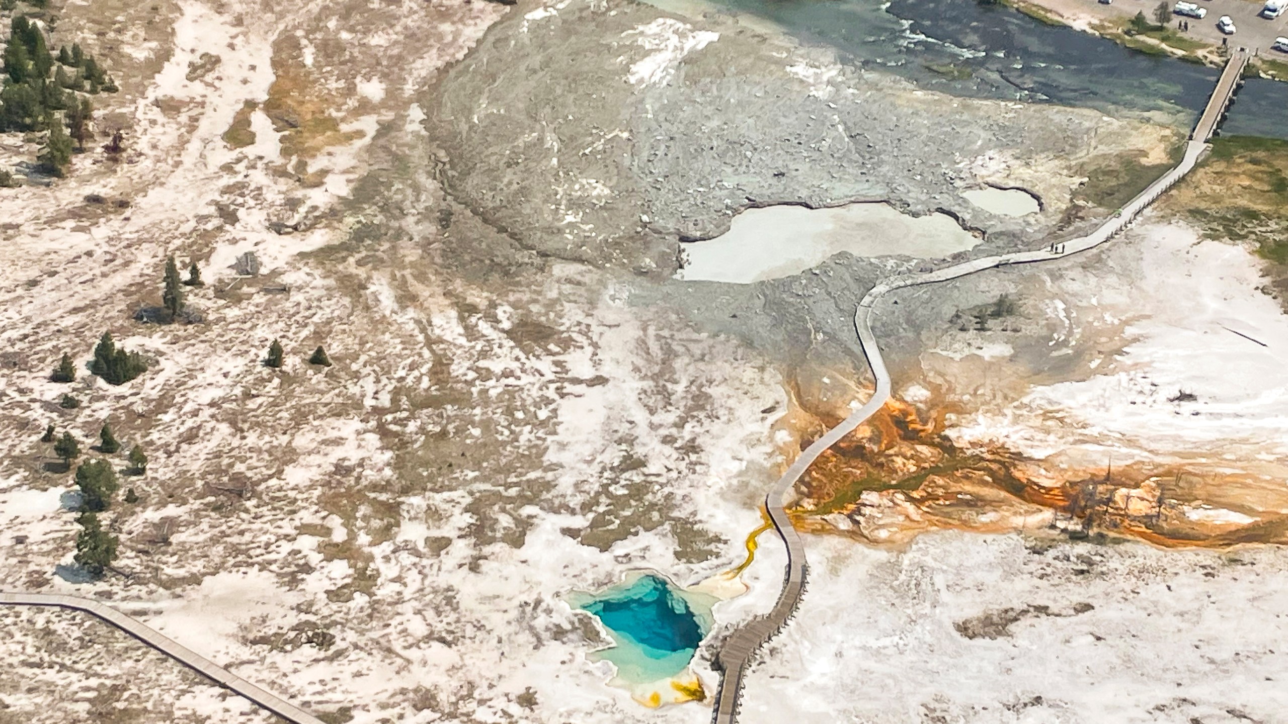 In this aerial photo released by the National Park Service, shows the damaged Biscuit Basin boardwalks after a hydrothermal explosion at Biscuit Basin in Yellowstone National Park, Wyo., Tuesday, July 23, 2024. (National Park Service via AP)
