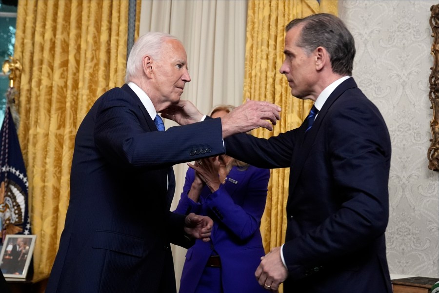 President Joe Biden hugs his son Hunter Biden after addressing the nation from the Oval Office of the White House in Washington, Wednesday, July 24, 2024, about his decision to drop his Democratic reelection bid. (AP Photo/Evan Vucci, Pool)