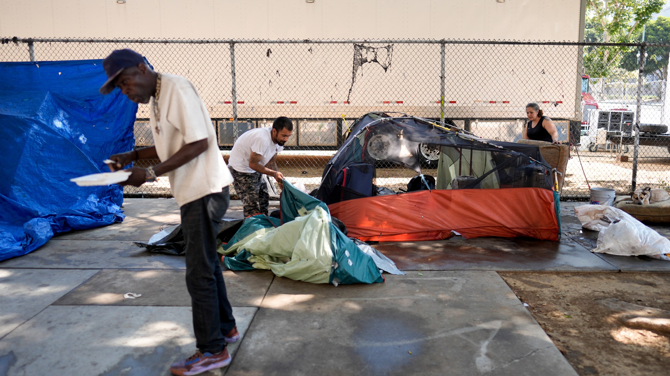 Tents are set up at an encampment Thursday, July 25, 2024, in Los Angeles. California Gov. Gavin Newsom issued an executive order Thursday to direct state agencies on how to remove homeless encampments, a month after a Supreme Court ruling allowing cities to enforce bans on sleeping outside in public spaces. (AP Photo/Jae C. Hong)