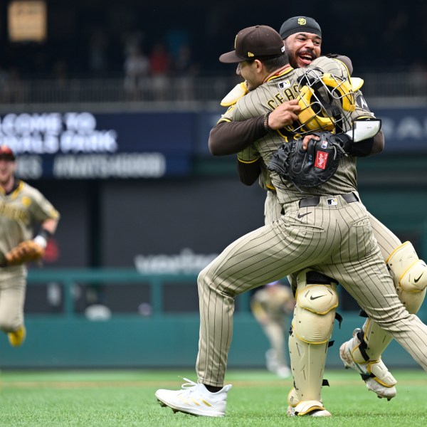 San Diego Padres starting pitcher Dylan Cease, center, celebrates his no-hitter with catcher Luis Campusano after the ninth inning of a baseball game against the Washington Nationals, Thursday, July 25, 2024, in Washington. (AP Photo/John McDonnell)