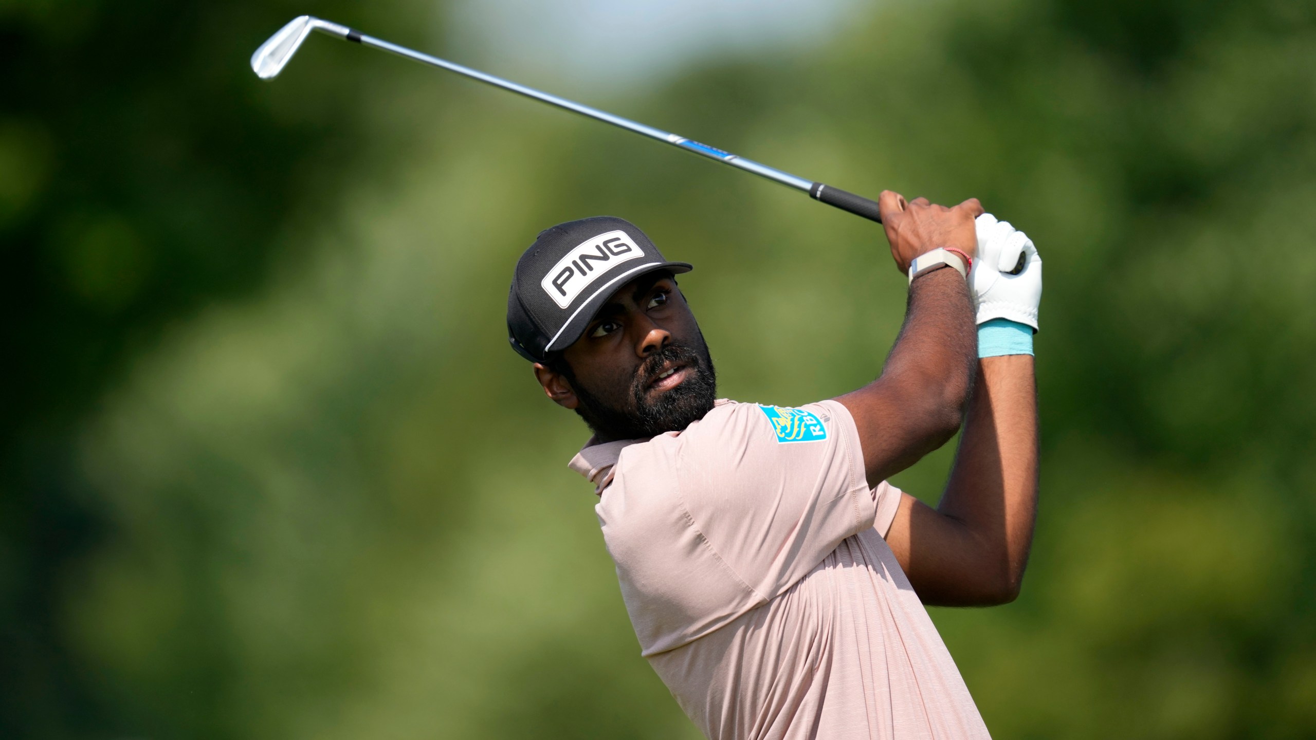 Sahith Theegala hits off the tee on the fourth hole during the first round of the 3M Open golf tournament at the Tournament Players Club, Thursday, July 25, 2024, in Blaine, Minn. (AP Photo/Charlie Neibergall)