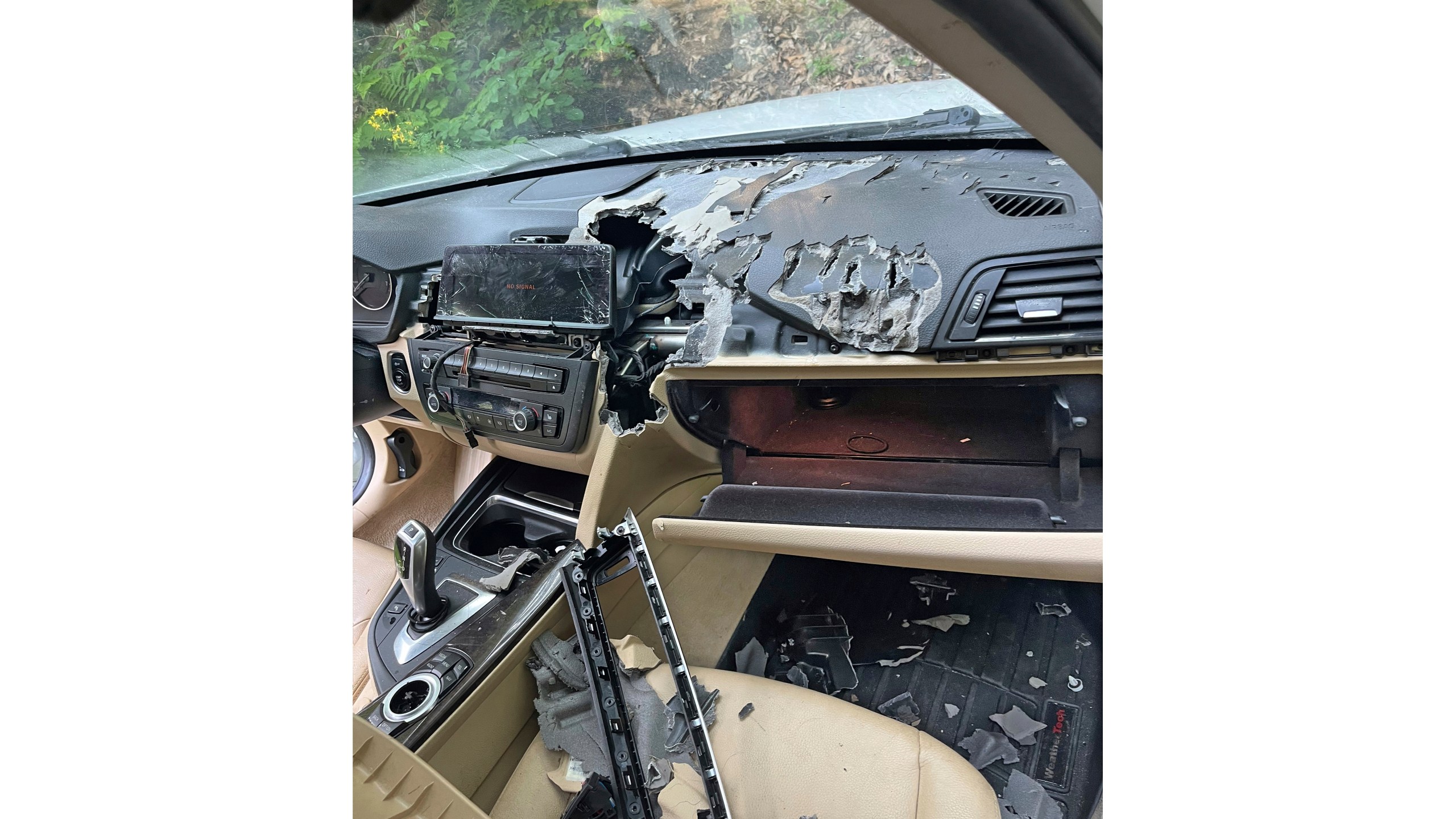 This July 15, 2024, photo shows the damage caused by a bear and cub that broke into a car, and became trapped inside in Winsted, CT, until freed by state environmental conservation police. It turned out to be the first of three episodes involving bears in Connecticut over six days that were publicly reported by the state Department of Energy and Environmental Protection — another sign of the increasing black bear population in the state. (AP Photo)