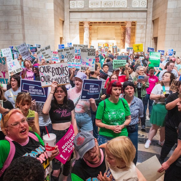FILE - Protesters chant as they are heard in the legislative chamber during a final reading on a bill that combined a 12-week abortion ban with a measure to restrict gender-affirming care for people under 19, May 16, 2023, at state Capitol in Lincoln, Neb. A Nebraska law that combined abortion restrictions with another measure to limit gender-affirming health care for minors does not violate a state constitutional amendment requiring bills to stick to a single subject, the Nebraska Supreme Court ruled Friday, July 26, 2024.(Kenneth Ferriera/Lincoln Journal Star via AP)