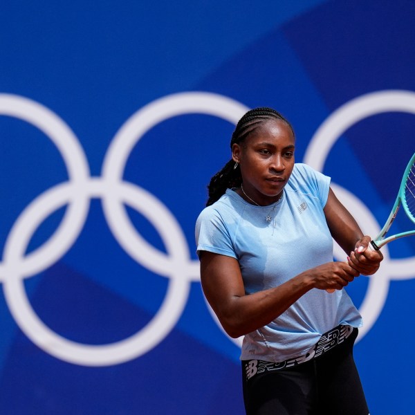 Coco Gauff of the U.S. returns the ball during a practice session ahead of the tennis competition, at the 2024 Summer Olympics, Thursday, July 25, 2024, in Paris, France. (AP Photo/Manu Fernandez)