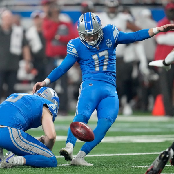 FILE - Detroit Lions place kicker Michael Badgley (17), with Jack Fox holding, kicks a field goal against the Tampa Bay Buccaneers during the first half of an NFL football NFC divisional playoff game, Sunday, Jan. 21, 2024, in Detroit. Badgley was injured before practice Thursday, July 26, 2204, and will require surgery. Coach Dan Campbell didn’t disclose the nature of the injury. (AP Photo/Paul Sancya, File)