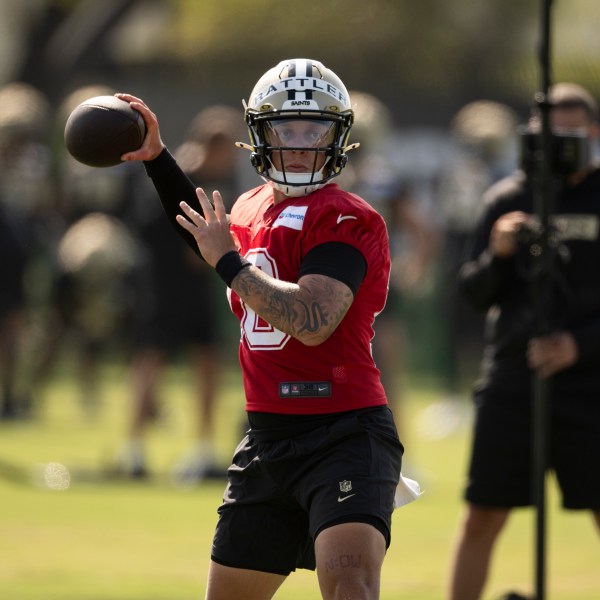 New Orleans Saints quarterback Spencer Rattler (18) throws a pass during NFL football training camp, Friday, July 26, 2024, in Irvine, Calif. (AP Photo/Kyusung Gong)