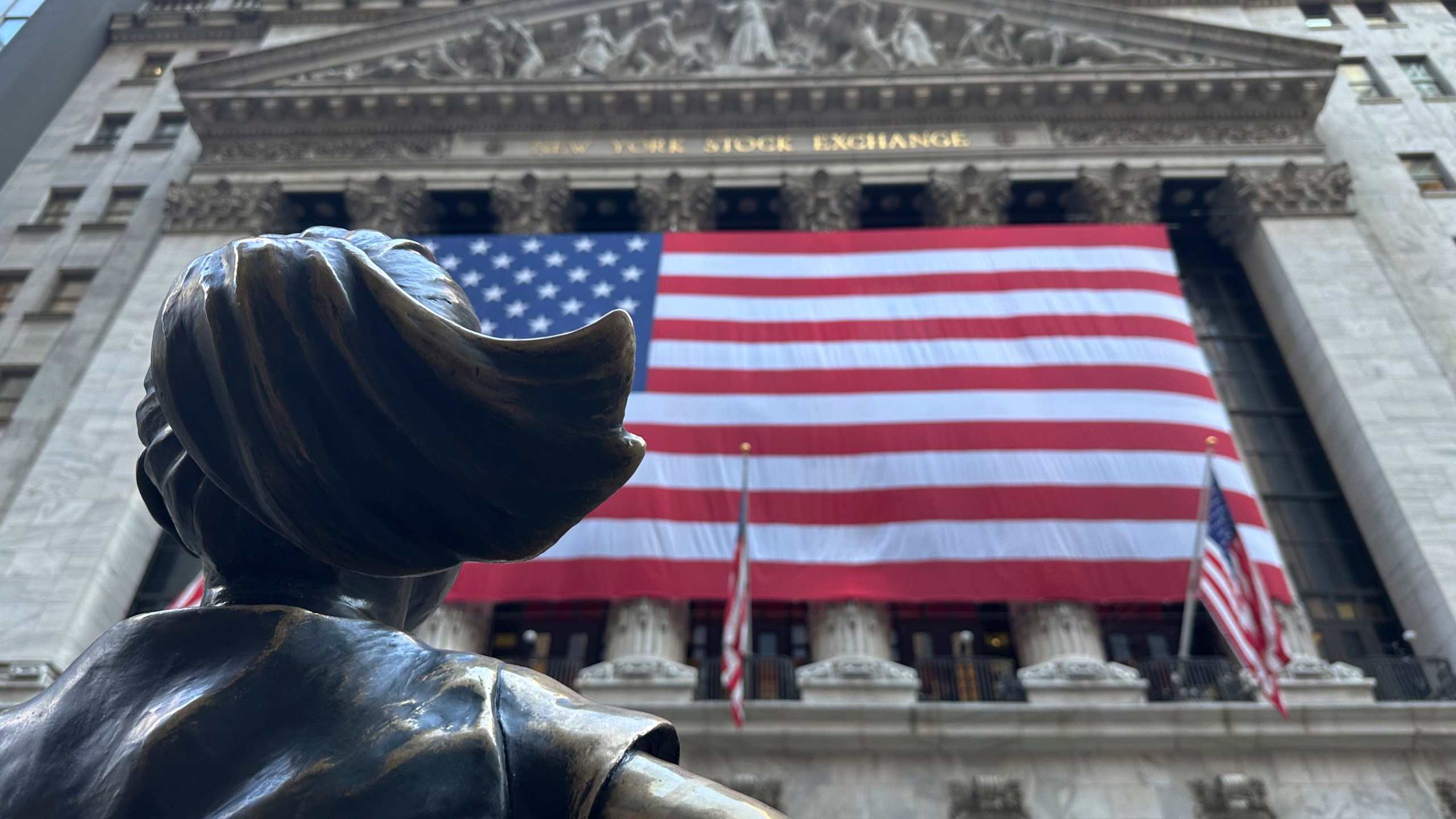 FILE - The Fearless Girl statues faces the New York Stock Exchange on July 2, 2024, in New York. (AP Photo/Peter Morgan)