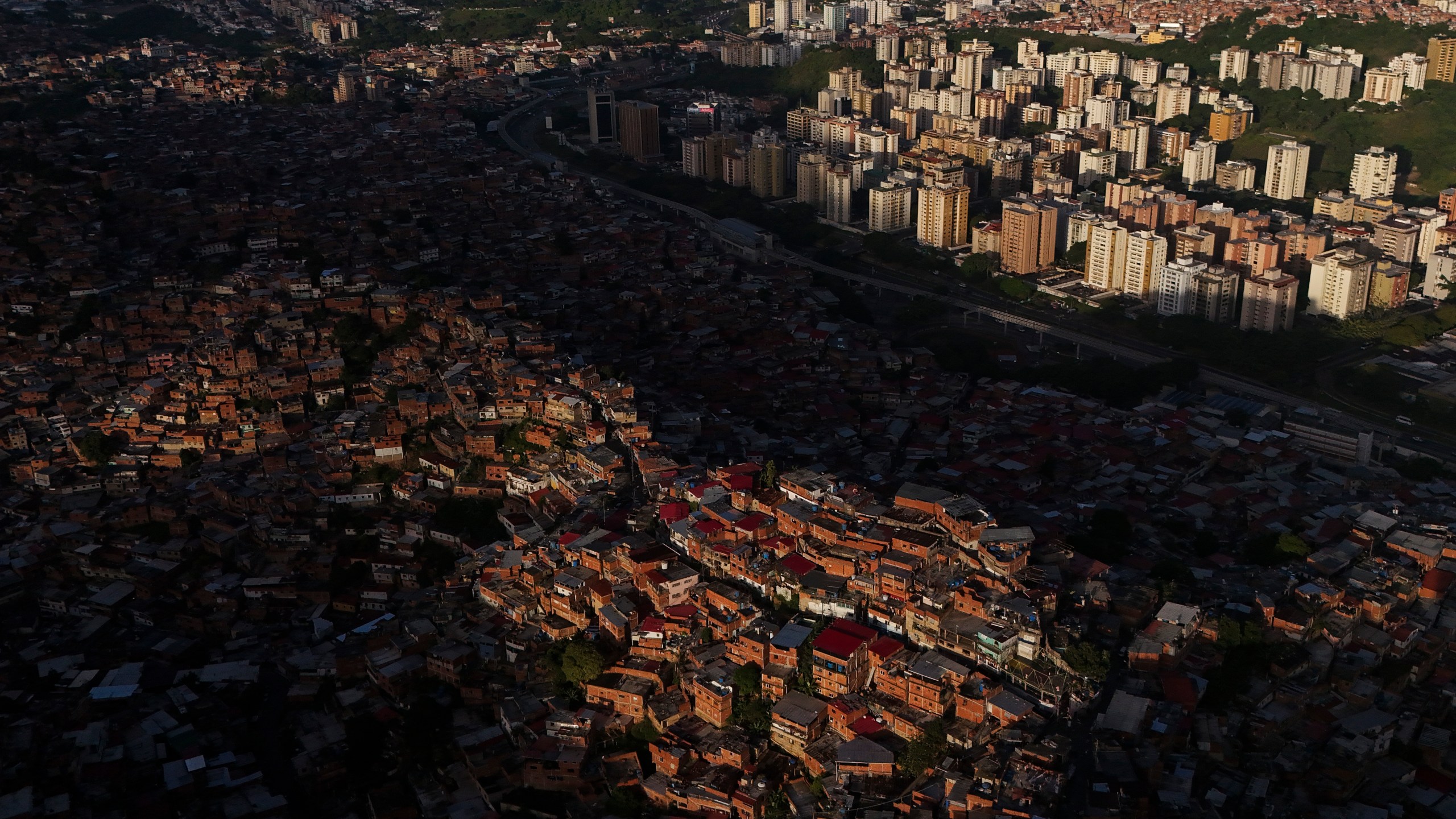 Homes cover a hill in the Petare neighborhood of Caracas, Venezuela, Thursday, July 25, 2024, days before the July 28 presidential election. (AP Photo/Matias Delacroix)