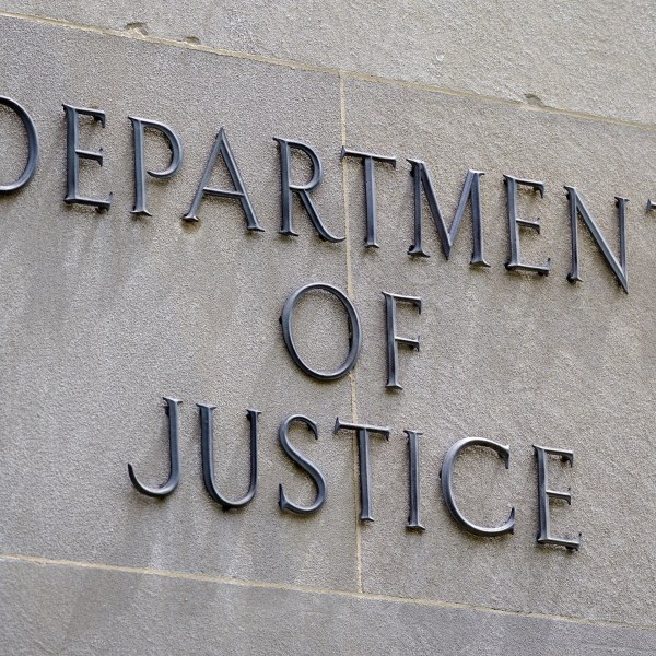 FILE - A sign outside the Robert F. Kennedy Department of Justice building is seen in Washington, May 4, 2021.