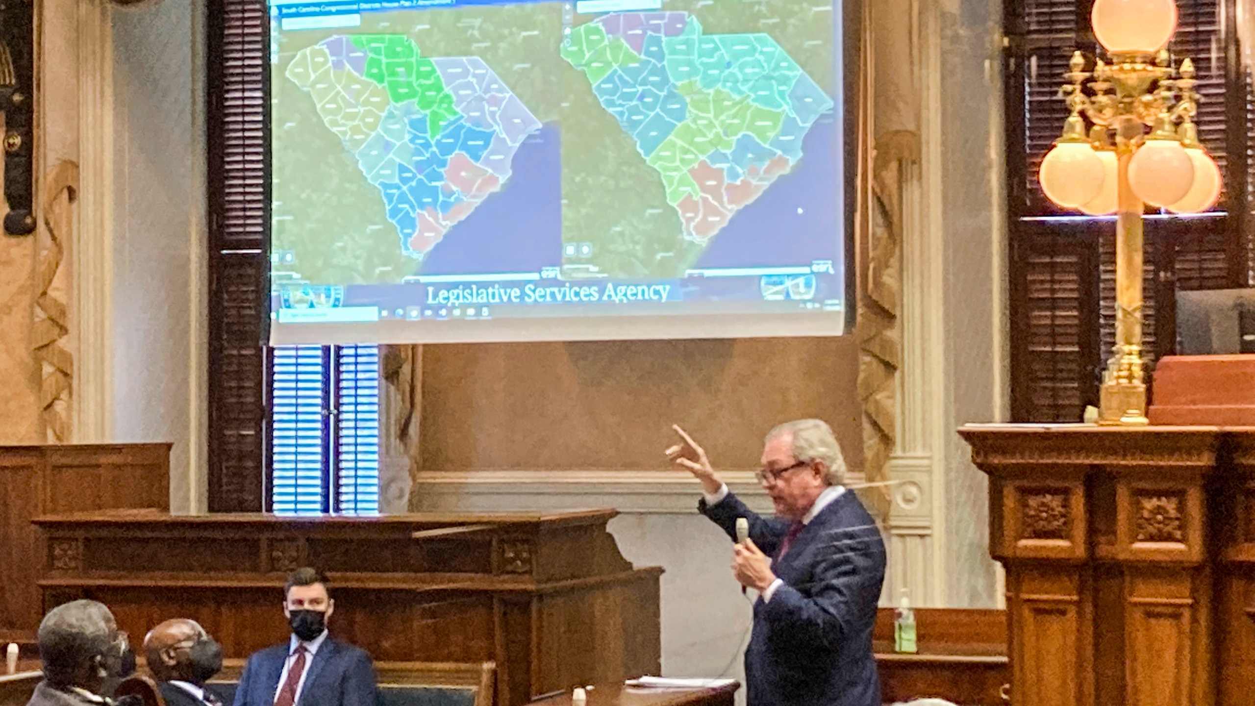 FILE - State Sen. Dick Harpootlian, D-Columbia, compares his proposed map of U.S. House districts drawn with 2020 U.S. Census data to a plan supported by Republicans on Jan. 20, 2022, in Columbia, S.C. A voting rights group sued South Carolina legislative leaders Monday, July 29, 2024, saying the maps they drew based on the 2020 Census lean too far toward Republicans. (AP Photo/Jeffrey Collins, File)