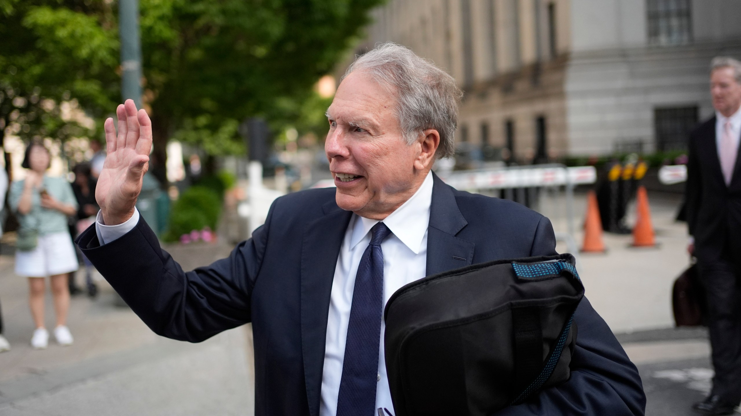 Wayne LaPierre, former CEO of the National Rifle Association, waves to someone as he leaves a courthouse in New York, Monday, July 29, 2024. A New York judge declined to appoint an outside monitor to oversee the finances and internal policies of the National Rifle Association. But he said he would bar LaPierre, the group's former leader, from holding a paid position in the organization for a decade. (AP Photo/Seth Wenig)