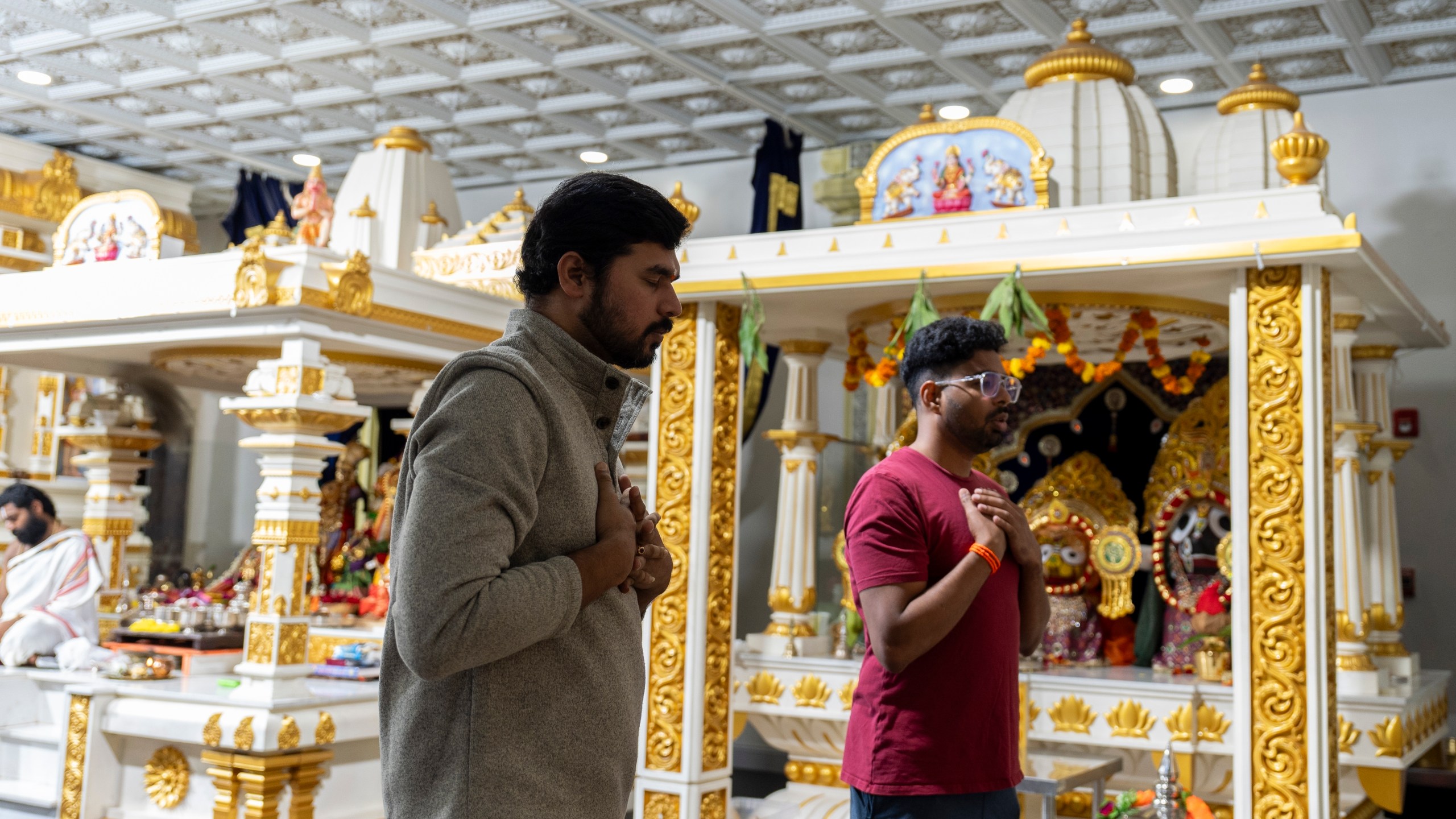 Worshippers pray at Sir Hanuman Mandir, a Hindu temple in Alpharetta, Ga., Tuesday, July 23, 2024. (AP Photo/Stephanie Scarbrough)