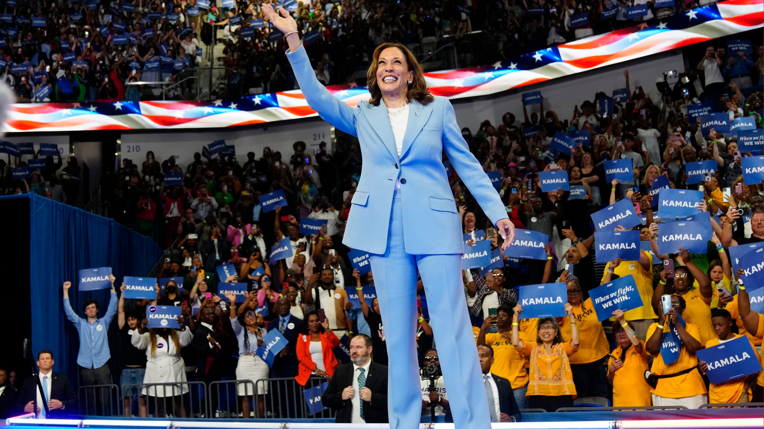 Vice President Kamala Harris waves during a campaign rally, Tuesday, July 30, 2024, in Atlanta. (AP Photo/John Bazemore)