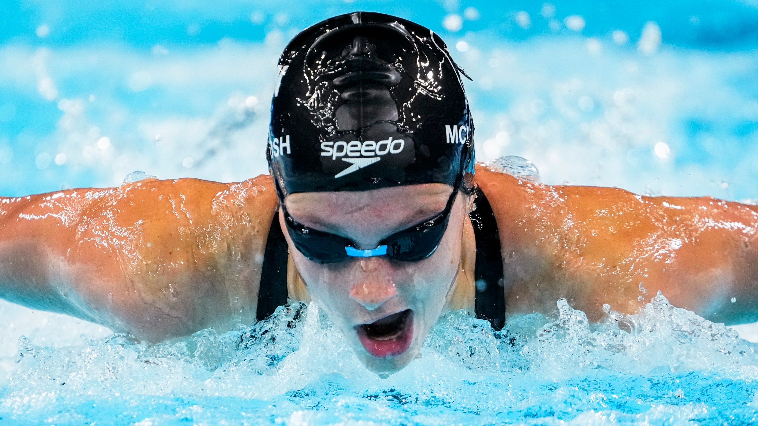 Summer McIntosh, of Canada, competes during a heat in the women's 200-meter butterfly at the 2024 Summer Olympics, Wednesday, July 31, 2024, in Nanterre, France. (AP Photo/Matthias Schrader)