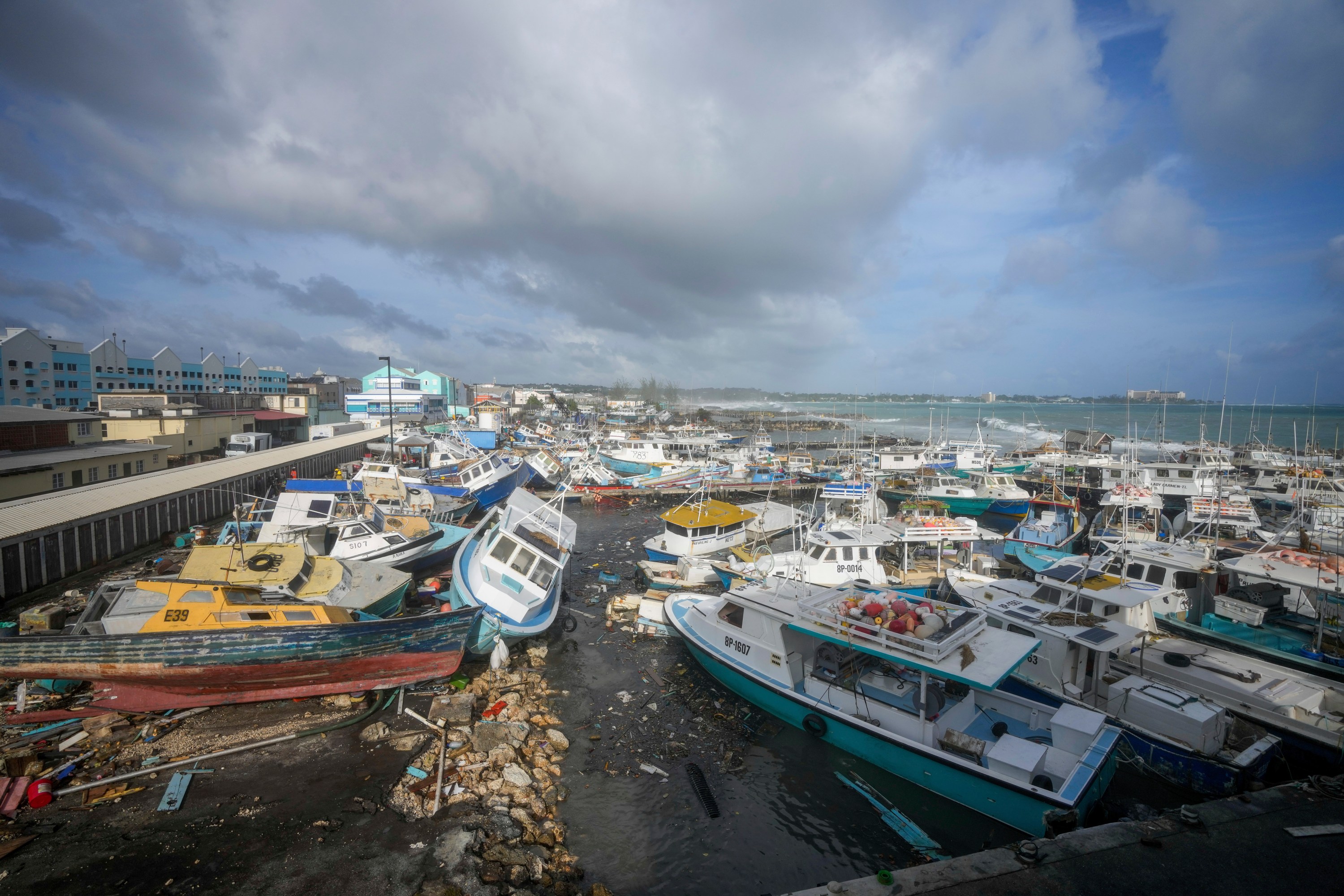 Fishing vessels lie damaged after Hurricane Beryl passed through the Bridgetown Fisheries in Barbados July 1, 2024