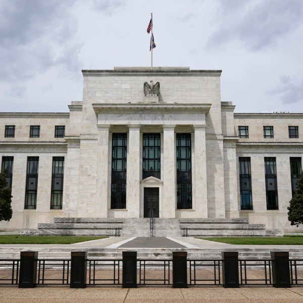 An American flag flies over the Federal Reserve building on May 4, 2021, in Washington.