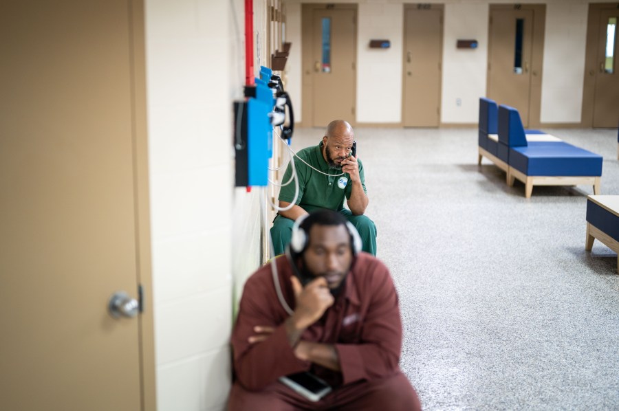 Inmates make phone calls at a prison in Chester, Pennsylvania.