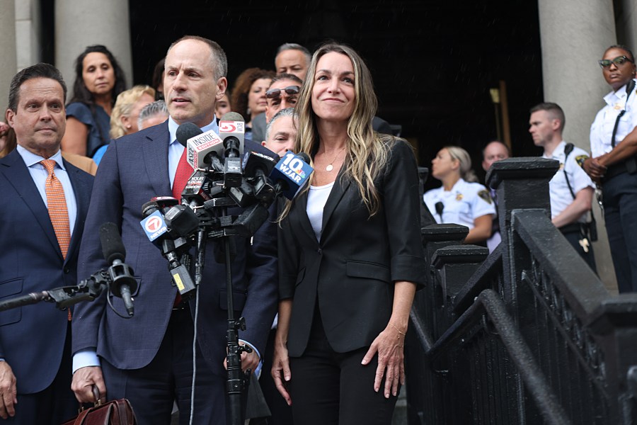 Karen Read and her lawyers address the media in front of Norfolk Superior Court