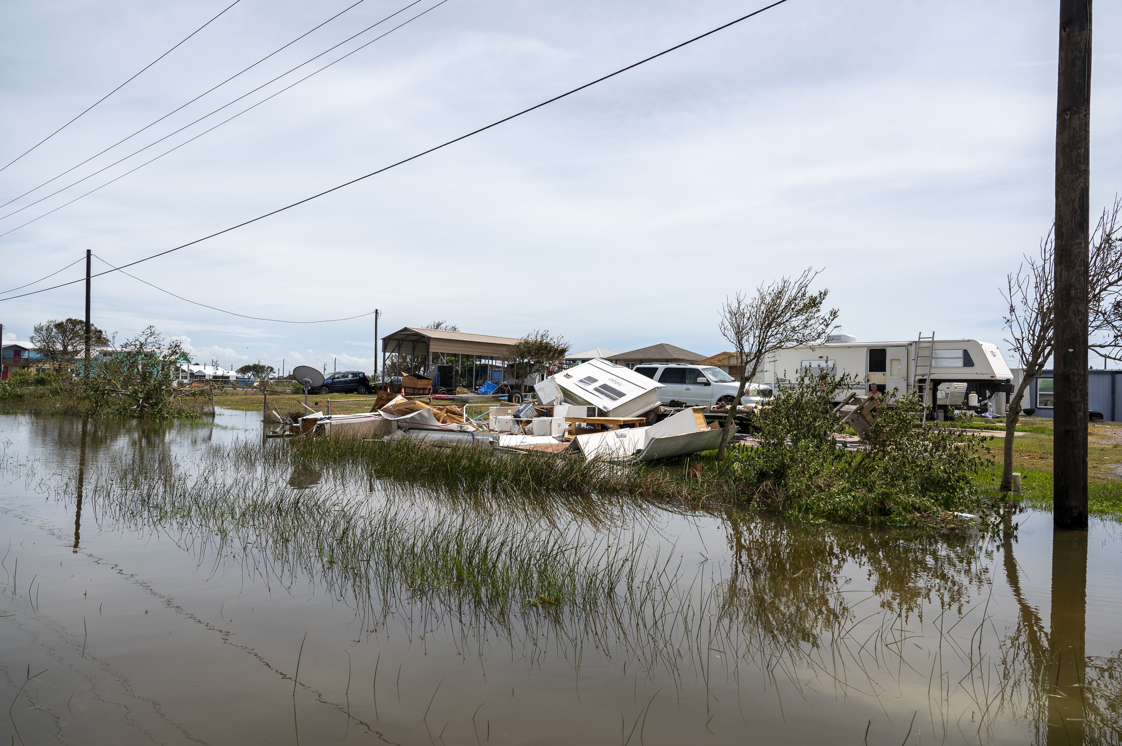 Debris from a destroyed mobile home in flooded waters after Hurricane Beryl made landfall in Sargent, Texas, US, on Monday, July 8, 2024.