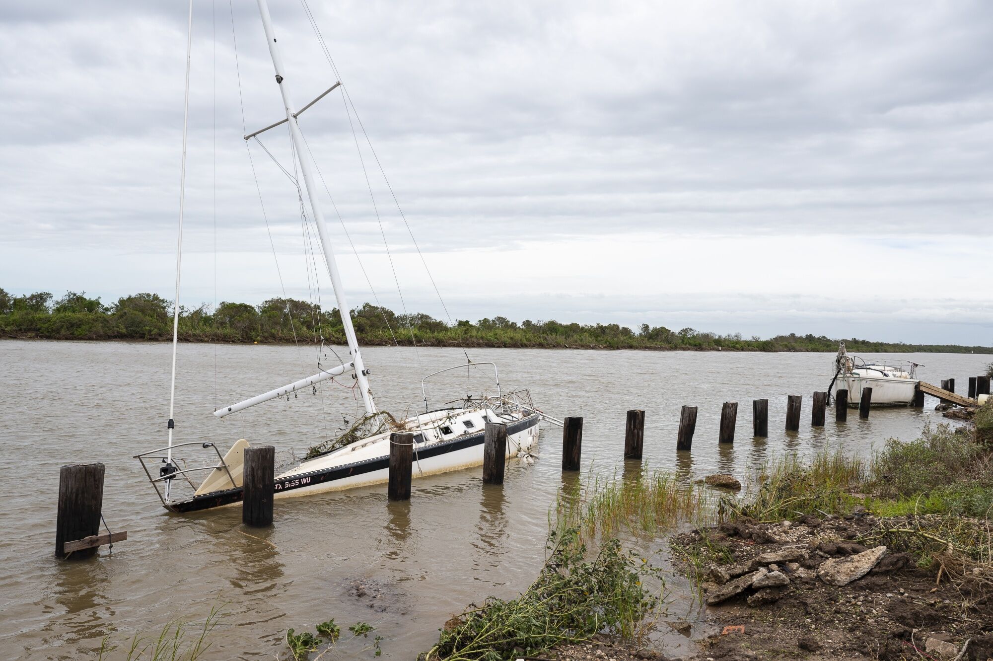 A partially sunken sailboat after Hurricane Beryl made landfall in Matagorda, Texas, US, on Monday, July 8, 2024.