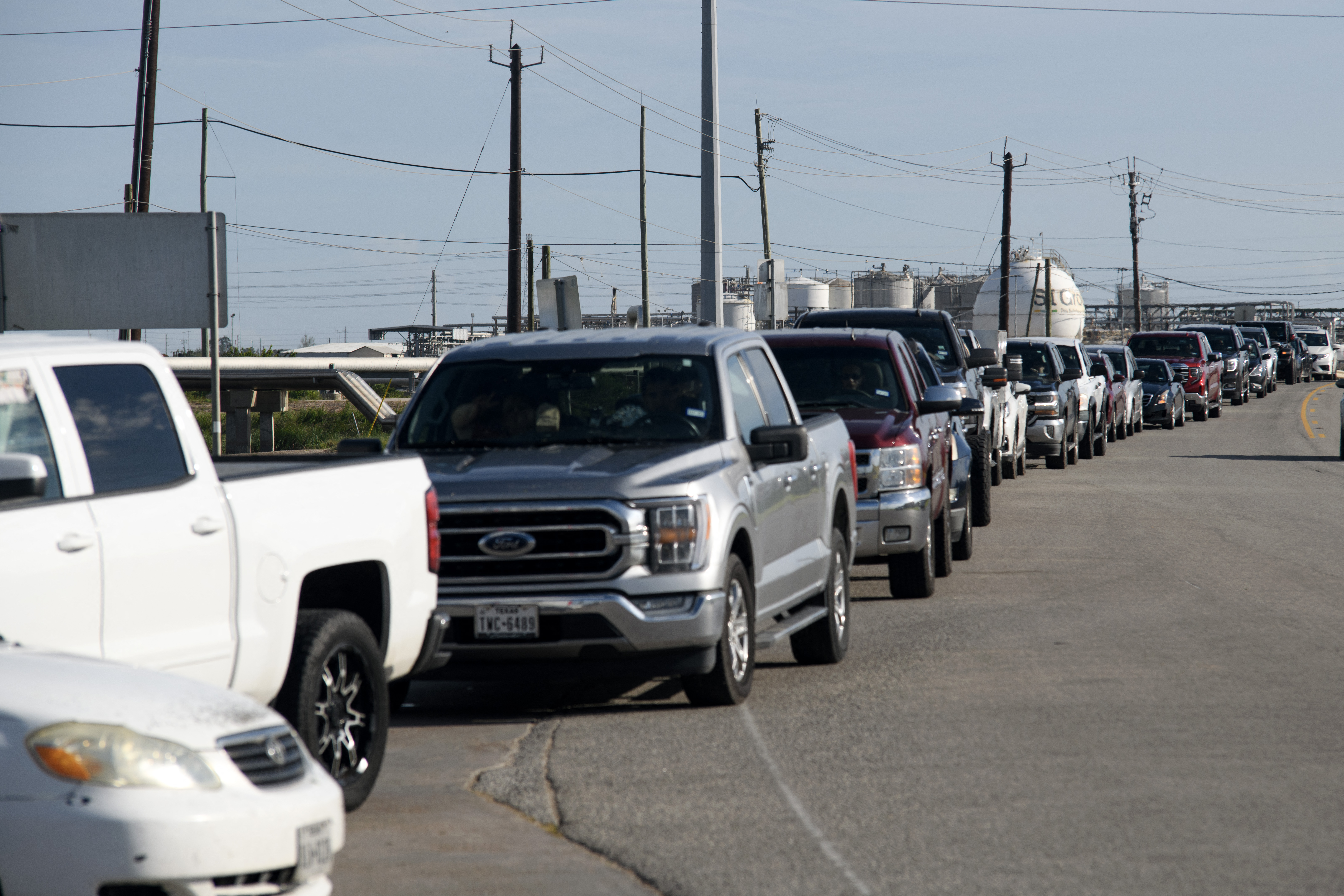 Cars line up outside of a gas station after the passage of Hurricane Beryl in Freeport, Texas, on July 8, 2024.