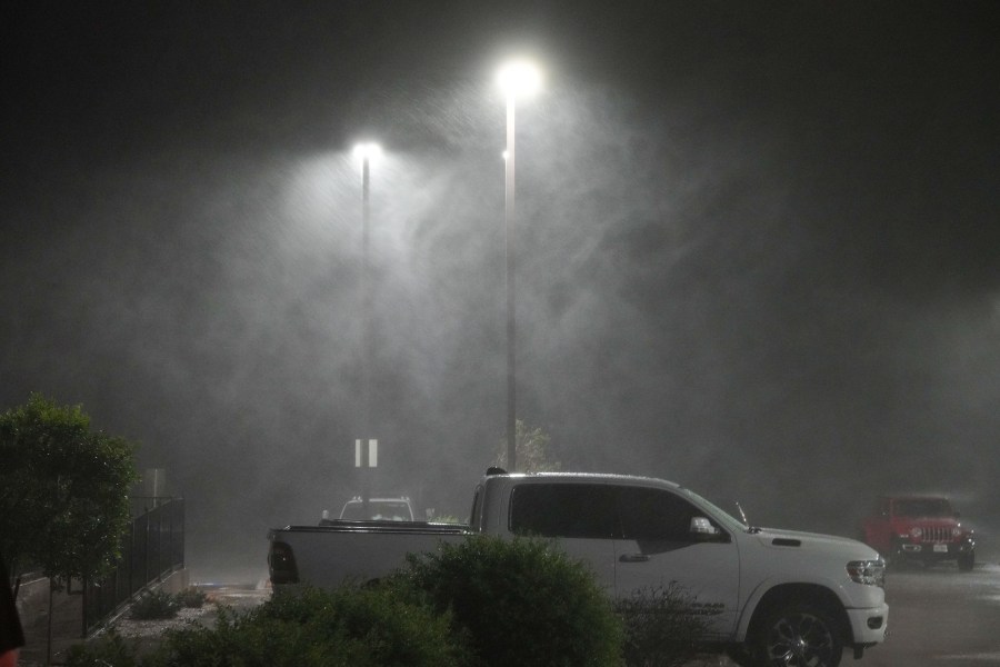 Heavy rain from Hurricane Beryl is illuminated by parking lot lights Monday, July 8, 2024, in Bay City. 