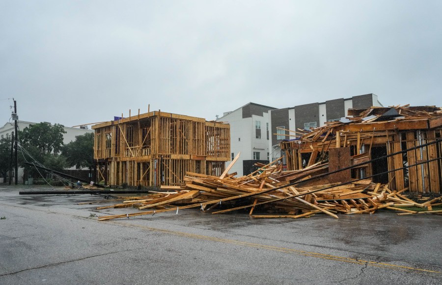 Construction falls on a power line as Hurricane Beryl makes landfall on Monday, July 8, 2024 in Houston.