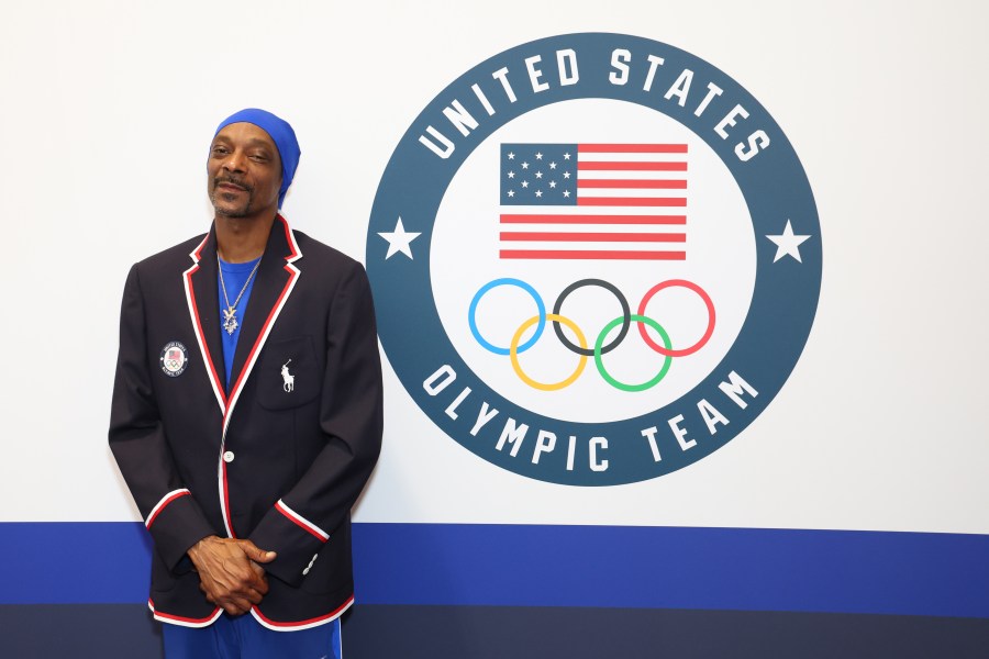 Snoop Dogg tries on clothes during Team USA Welcome Experience ahead of Paris 2024 Summer Olympics at Polo Ralph Lauren on July 21, 2024 in Paris, France.