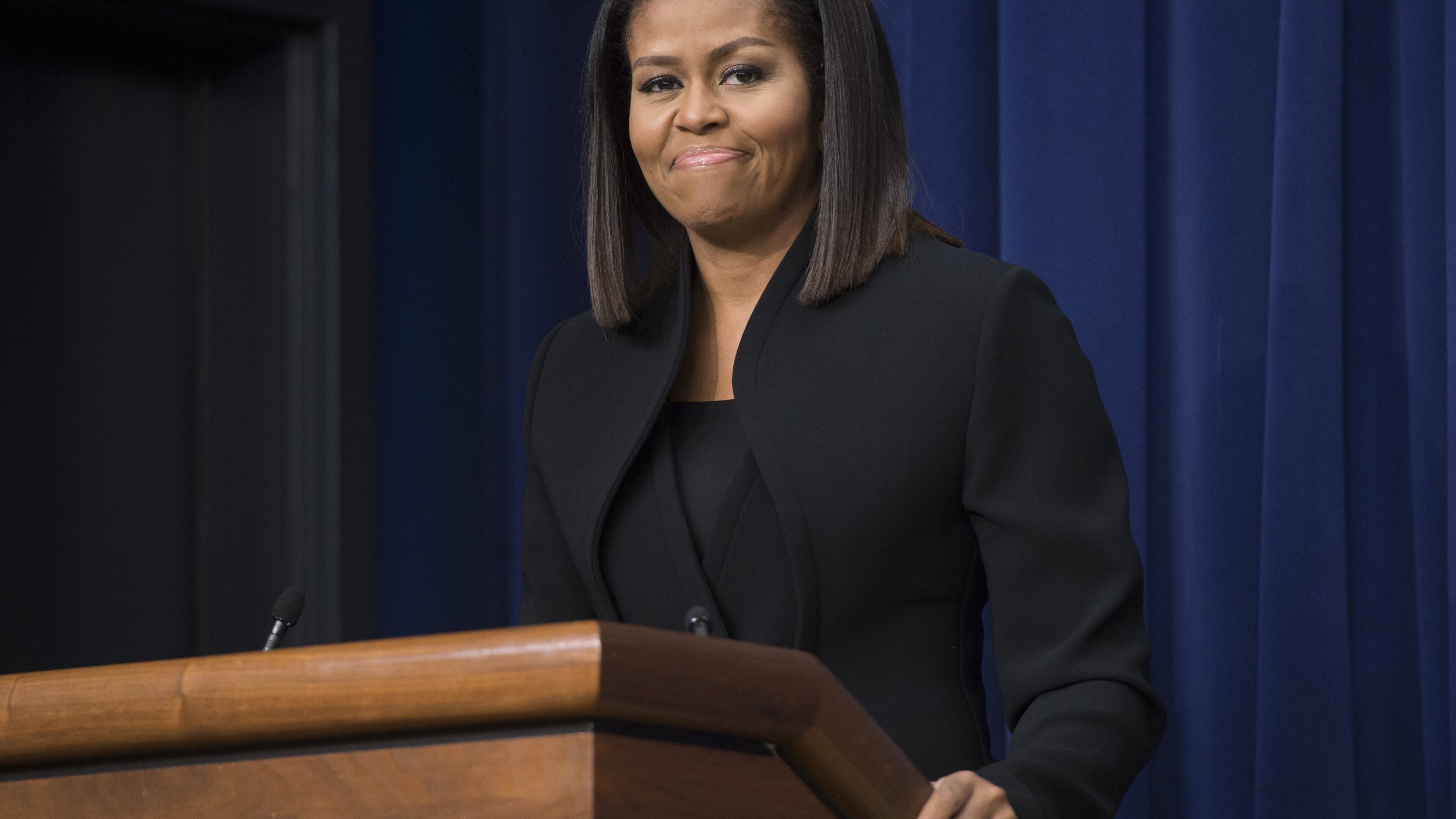 US First Lady Michelle Obama speaks following a screening of the movie, "Hidden Figures," in the Eisenhower Executive Office Building adjacent to the White House in Washington, DC, December 15, 2016.