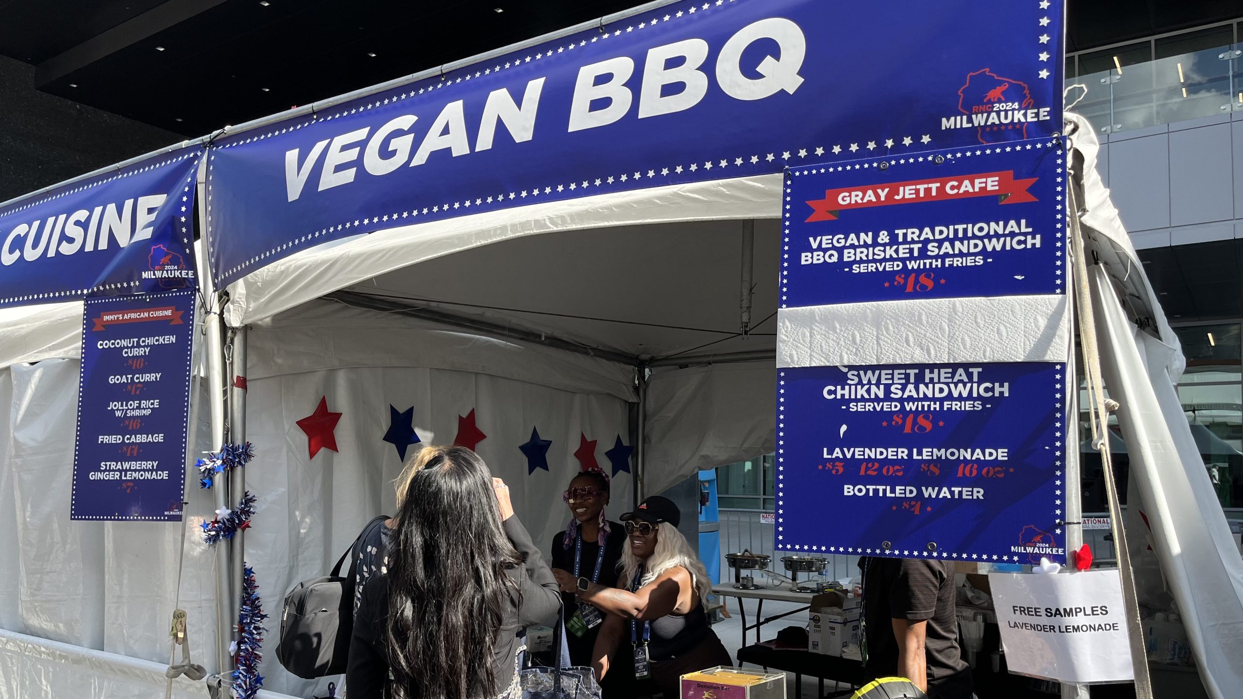 People at RNC buy food from vegan barbecue stall.