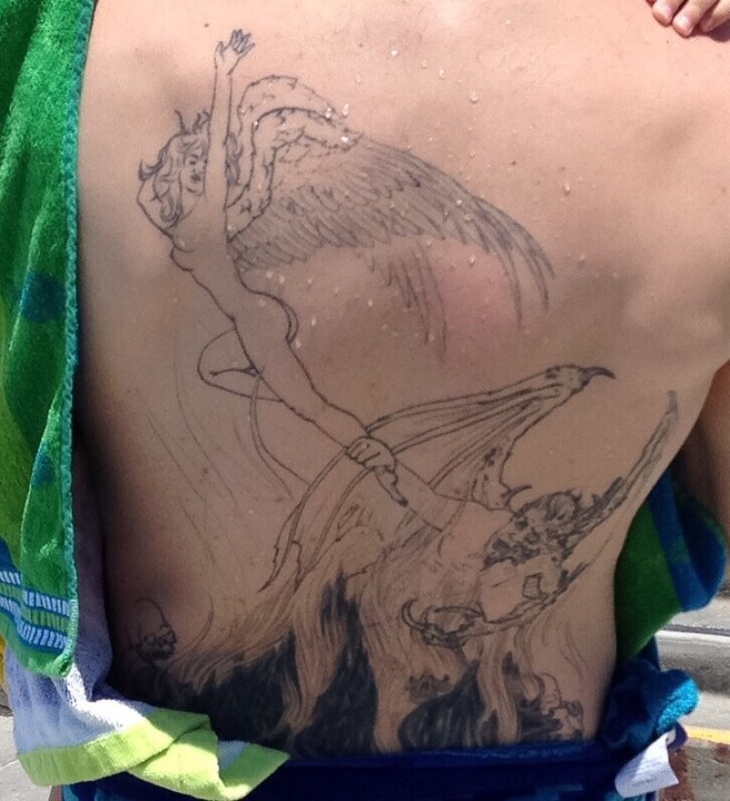 An outline tattoo on someone's back.