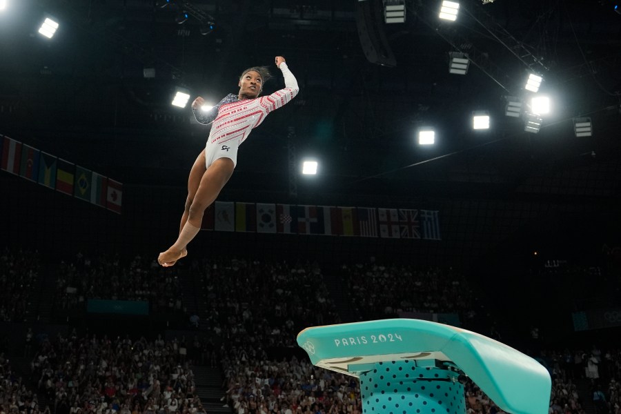 Simone Biles, of the United States, performs on the vault during the women's artistic gymnastics team finals round at Bercy Arena at the 2024 Summer Olympics, Tuesday, July 30, 2024, in Paris, France. (AP Photo/Charlie Riedel)