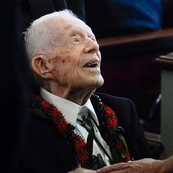 FILE - Former President Jimmy Carter greets attendees as he departs the funeral service for his wife, former first lady Rosalynn Carter, at Maranatha Baptist Church in Plains, Ga., Nov. 29, 2023. Former President Carter will be honored next month, ahead of his 100th birthday, with a musical gala at the Fox Theatre in Atlanta, The Carter Center announced Thursday, Aug. 1, 2024. (AP Photo/Alex Brandon, Pool, File)