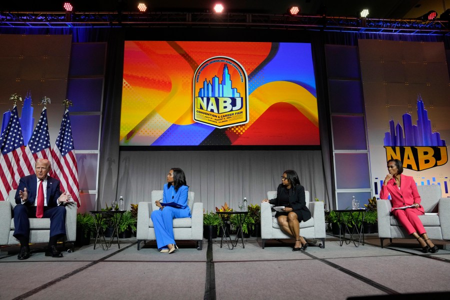 Republican presidential candidate former President Donald Trump, left, moderated by from left, ABC's Rachel Scott, Semafor's Nadia Goba and FOX News' Harris Faulkner, speaks at the National Association of Black Journalists, NABJ, convention, Wednesday, July 31, 2024, in Chicago. (AP Photo/Charles Rex Arbogast)