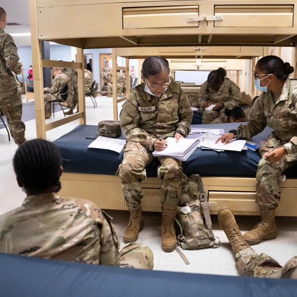 FILE - Students enlisted in the new Army prep course work together in barracks at Fort Jackson in Columbia, S.C., Aug. 26, 2022. The Army will expand its basic combat training for newly enlisted soldiers in what its leaders hope reflects a turning point as it prepares to meet the challenges of future wars. The added training will begin in October 2024 and comes as the Army works to reverse several years of dismal recruiting when it failed to meet its enlistment goals. (AP Photo/Sean Rayford, File)