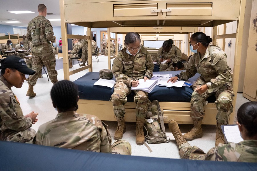 FILE - Students enlisted in the new Army prep course work together in barracks at Fort Jackson in Columbia, S.C., Aug. 26, 2022. The Army will expand its basic combat training for newly enlisted soldiers in what its leaders hope reflects a turning point as it prepares to meet the challenges of future wars. The added training will begin in October 2024 and comes as the Army works to reverse several years of dismal recruiting when it failed to meet its enlistment goals. (AP Photo/Sean Rayford, File)