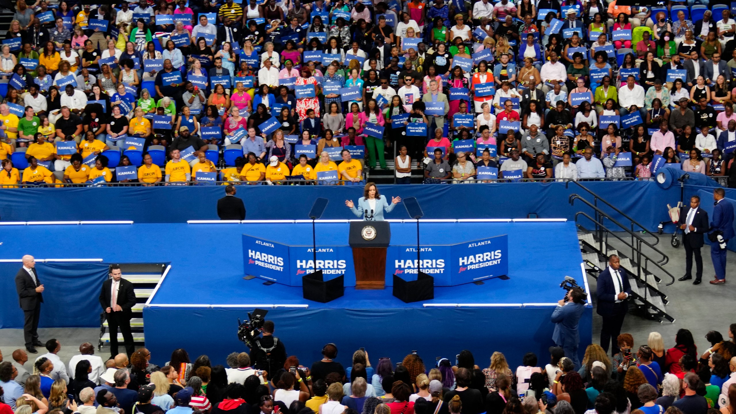 FILE - Vice President Kamala Harris speaks during a campaign rally, July 30, 2024, in Atlanta. Harris and former President Donald Trump held dueling Georgia rallies four days apart, but the dynamics showcased how deeply divided the American electorate is. The Harris crowd was majority Black and female. Trump's crowd was overwhelmingly white. They listened to different music. They heard wildly different arguments on immigration, the economy, voting rights. Either Harris or Trump will win. The question is how widely the winner will be accepted. (AP Photo/John Bazemore, File)