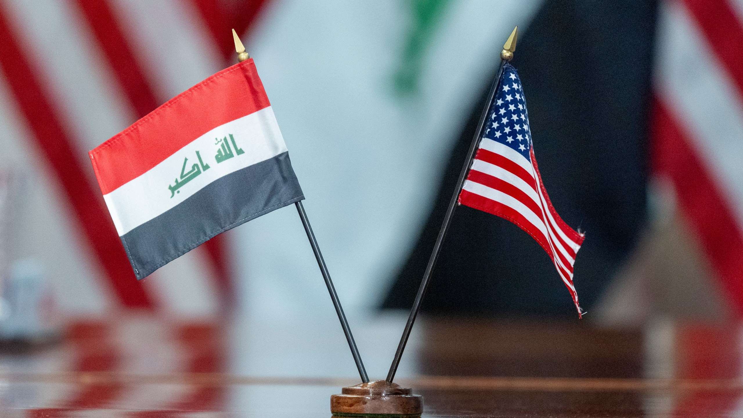 The flags of Iraq and the United States are placed on the table during a meeting with Secretary of Defense Lloyd Austin meets and Iraqi Defense Minister Muhammad Al-Abbasi at the Pentagon, Tuesday, July 23, 2024, in Washington. (AP Photo/Alex Brandon)