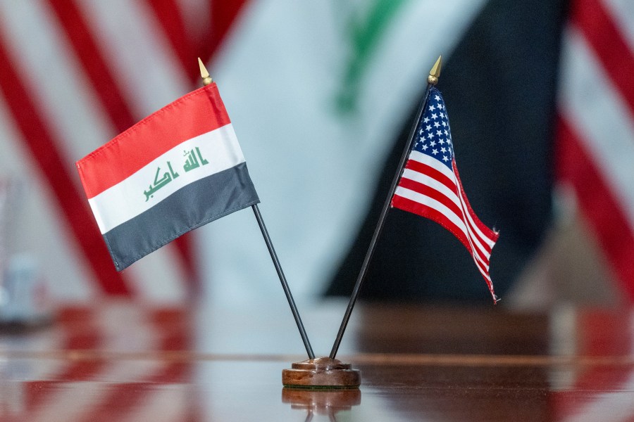 The flags of Iraq and the United States are placed on the table during a meeting with Secretary of Defense Lloyd Austin meets and Iraqi Defense Minister Muhammad Al-Abbasi at the Pentagon, Tuesday, July 23, 2024, in Washington. (AP Photo/Alex Brandon)