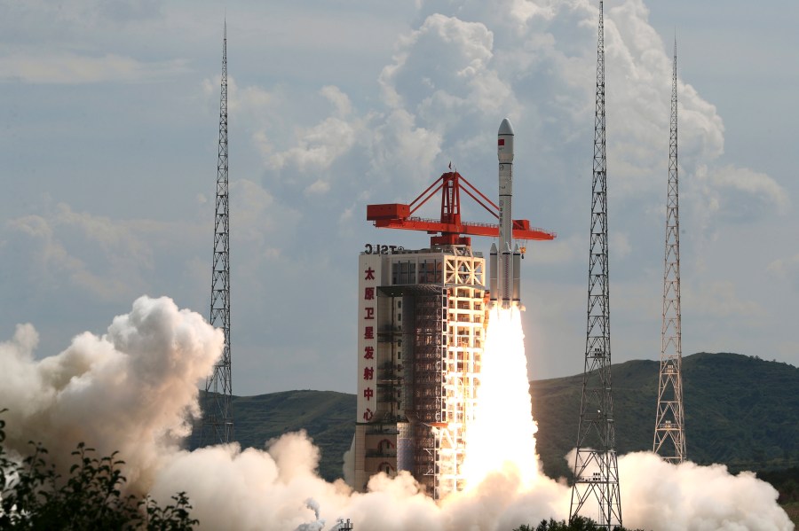 In this photo released by Xinhua News Agency, a modified Long March-6 carrier rocket carrying a new satellite group blasts off from the Taiyuan Satellite Launch Center in north China's Shanxi Province on Tuesday, Aug. 6, 2024. China says it launched the rocket Tuesday carrying a constellation of a reported 18 satellites as part of efforts to assert its presence in space. (Zheng Bin/Xinhua via AP)