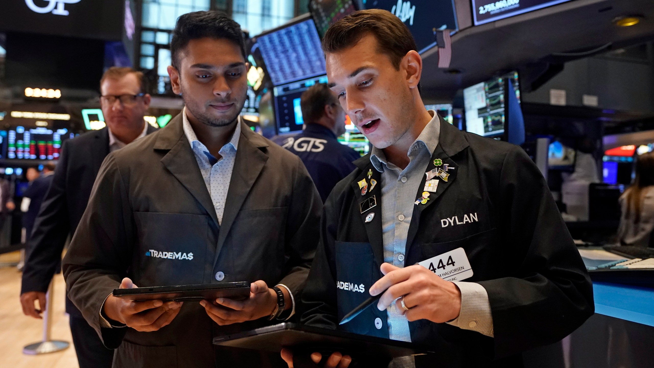 A pair of traders work on the floor of the New York Stock Exchange, Tuesday, Aug. 6, 2024.(AP Photo/Richard Drew)