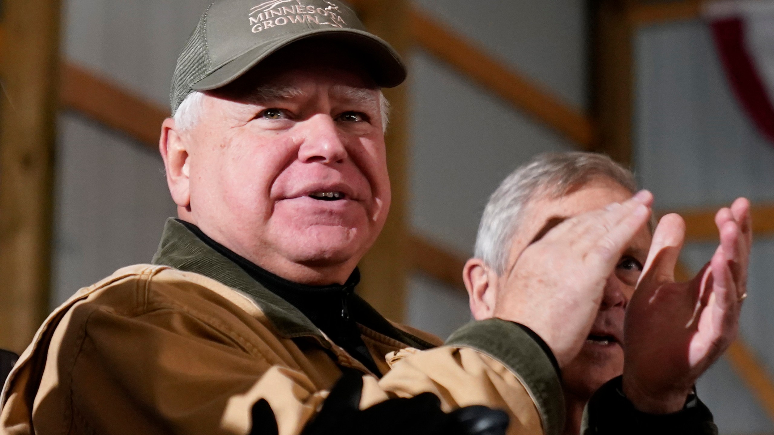 FILE - Minnesota Gov. Tim Walz applauds as President Joe Biden speaks at Dutch Creek Farms in Northfield, Minn., Nov. 1, 2023. (AP Photo/Andrew Harnik, File)