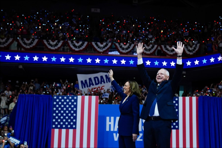 Democratic presidential nominee Vice President Kamala Harris and her running mate Minnesota Gov. Tim Walz arrive at a campaign rally in Philadelphia, Tuesday, Aug. 6, 2024. (AP Photo/Matt Rourke)