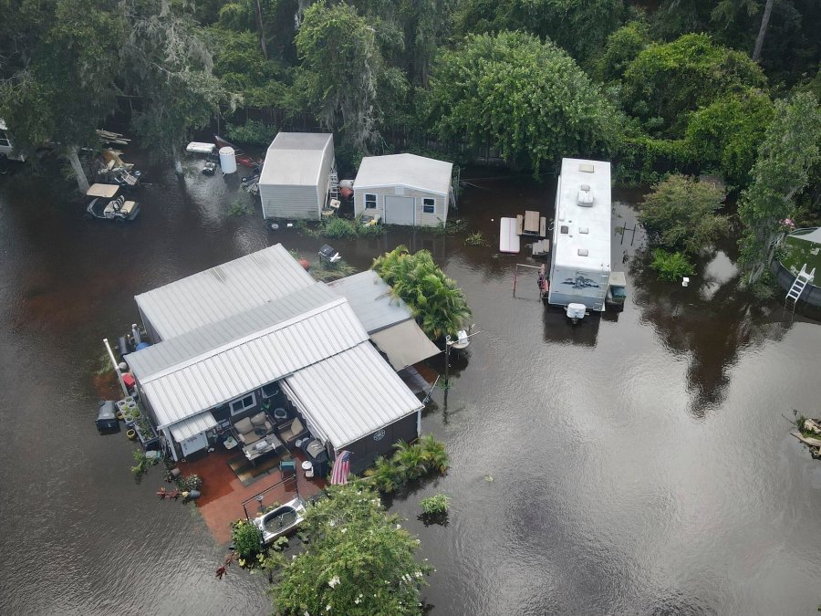 Bullfrog Creek, a tributary of the Alafie River, left some creekside homes inundated with floodwaters following Tropical Storm Debby, Tuesday, Aug. 6, 2024, in Alafia, Fla. (Max Chesnes/Tampa Bay Times via AP)