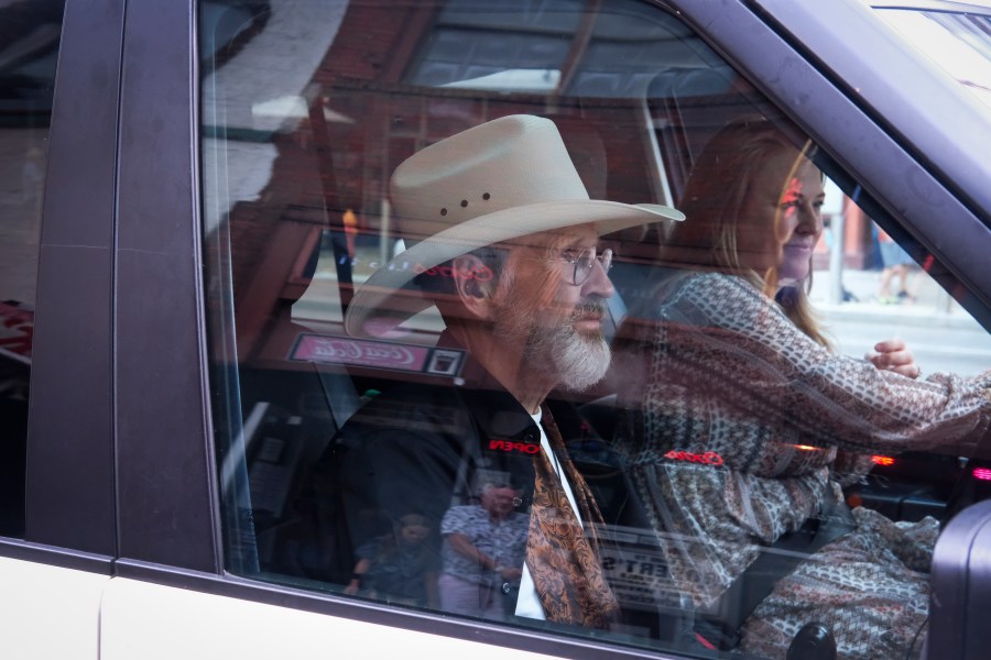 Mimi Fischer, right, and her father, the Rev. Ron Blakely, leave Robert’s Western World after the Gospel Hour held at the Nashville honky tonk on Sunday, July 28, 2024, in Nashville, Tenn. (AP Photo/Luis Andres Henao)